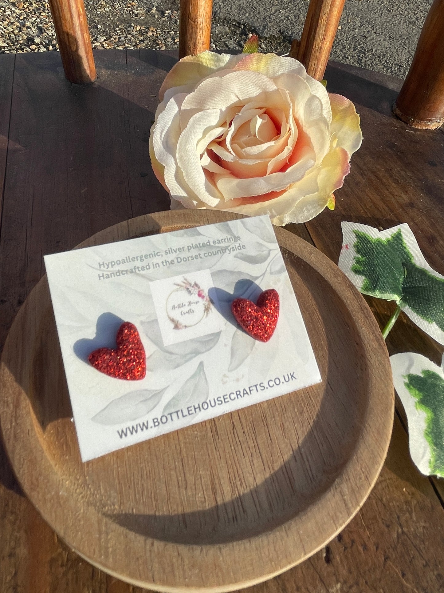 Red glitter heart studs