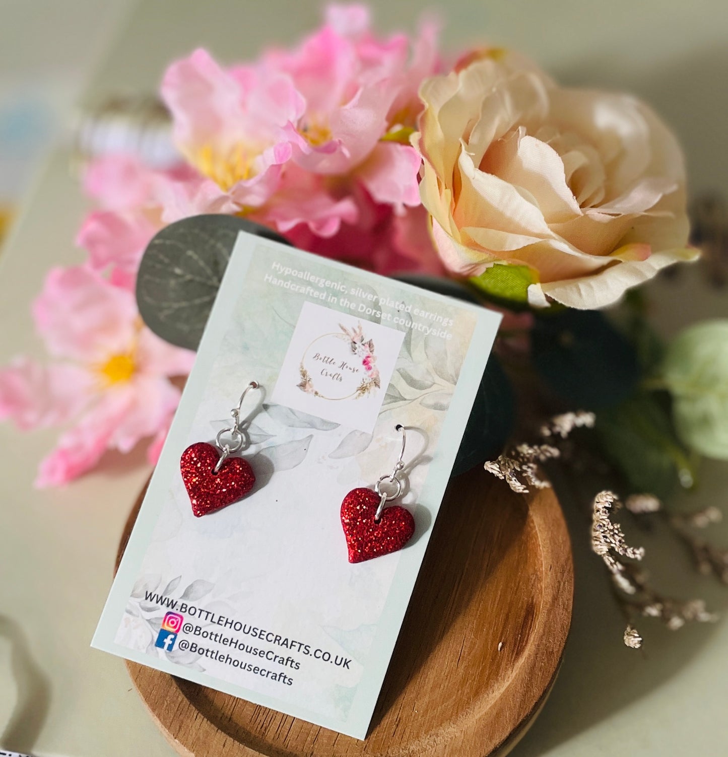 Red heart dangle earrings