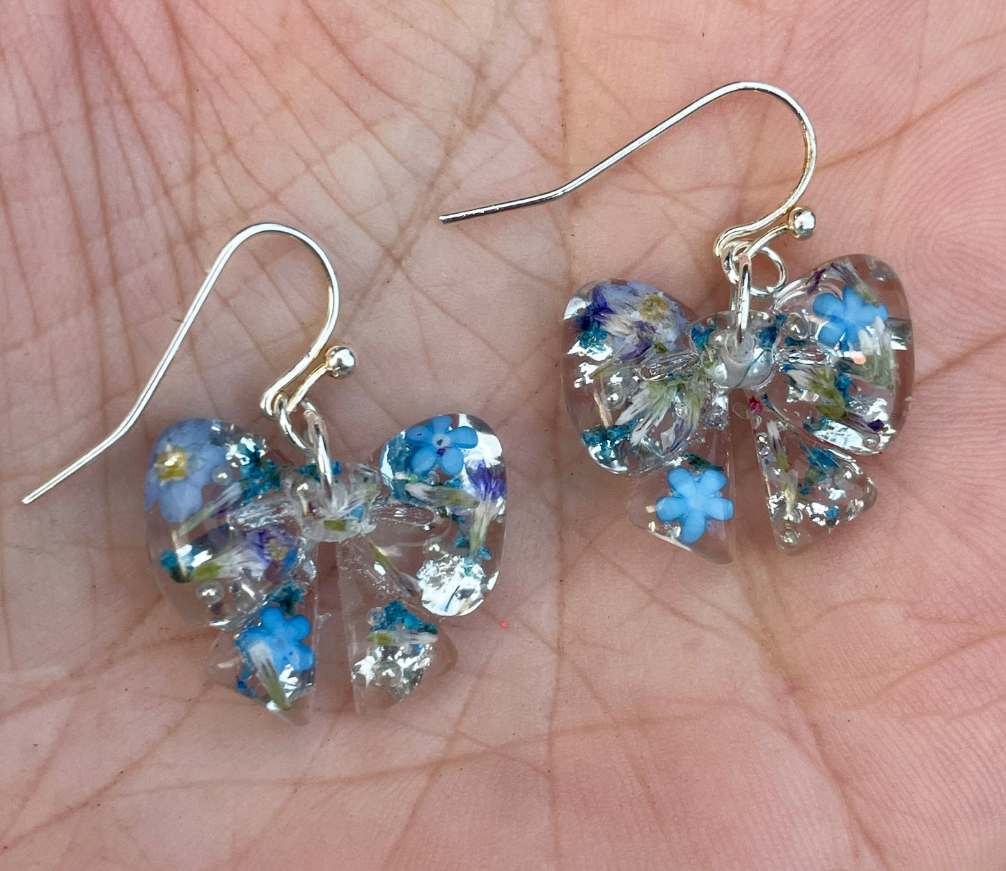 Blue burst bow earrings