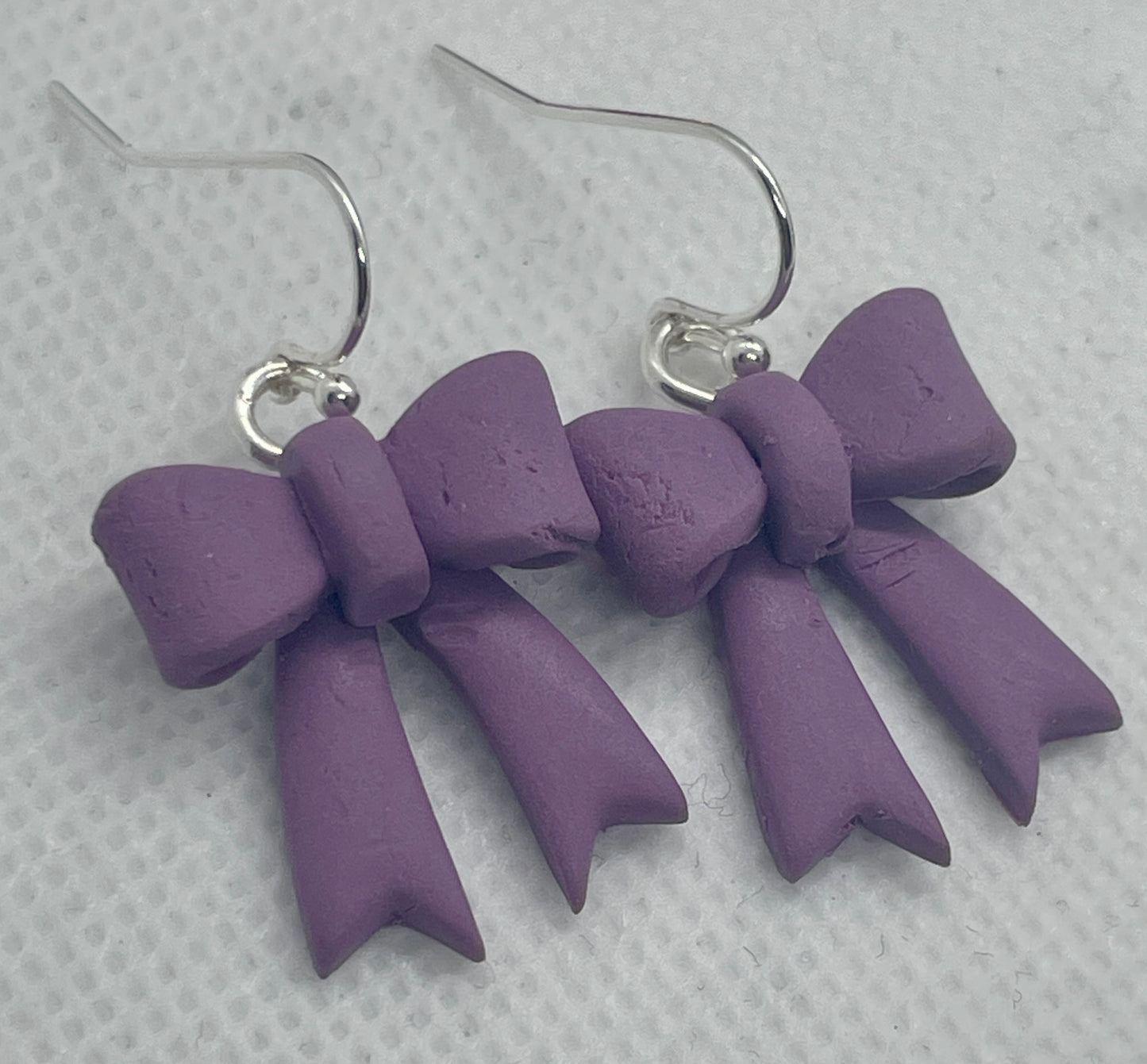 Larger purple winter bow earrings