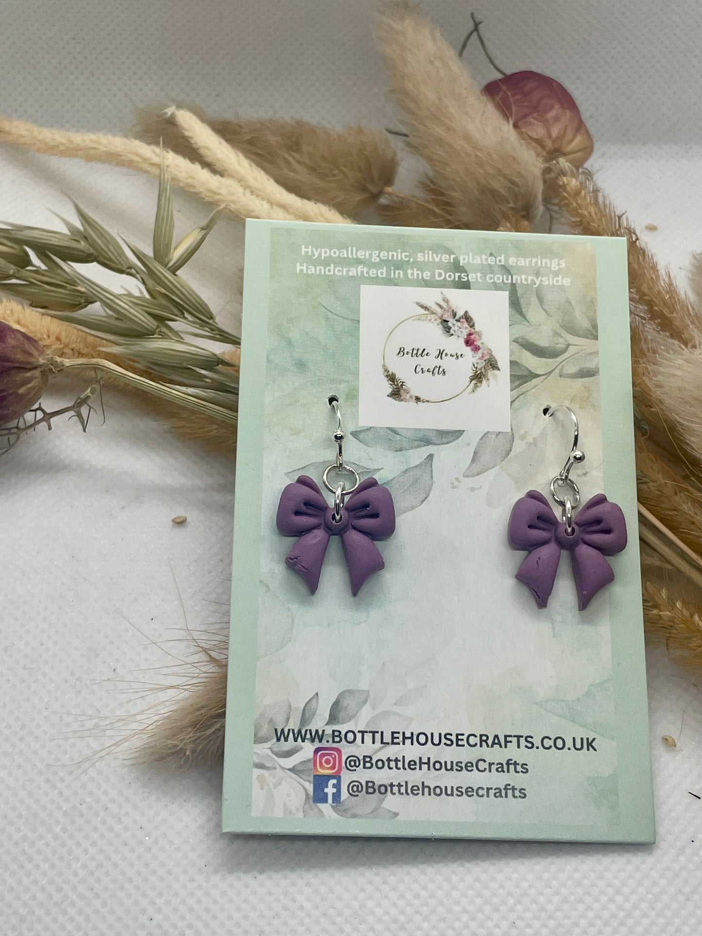 Midi purple winter bow earrings