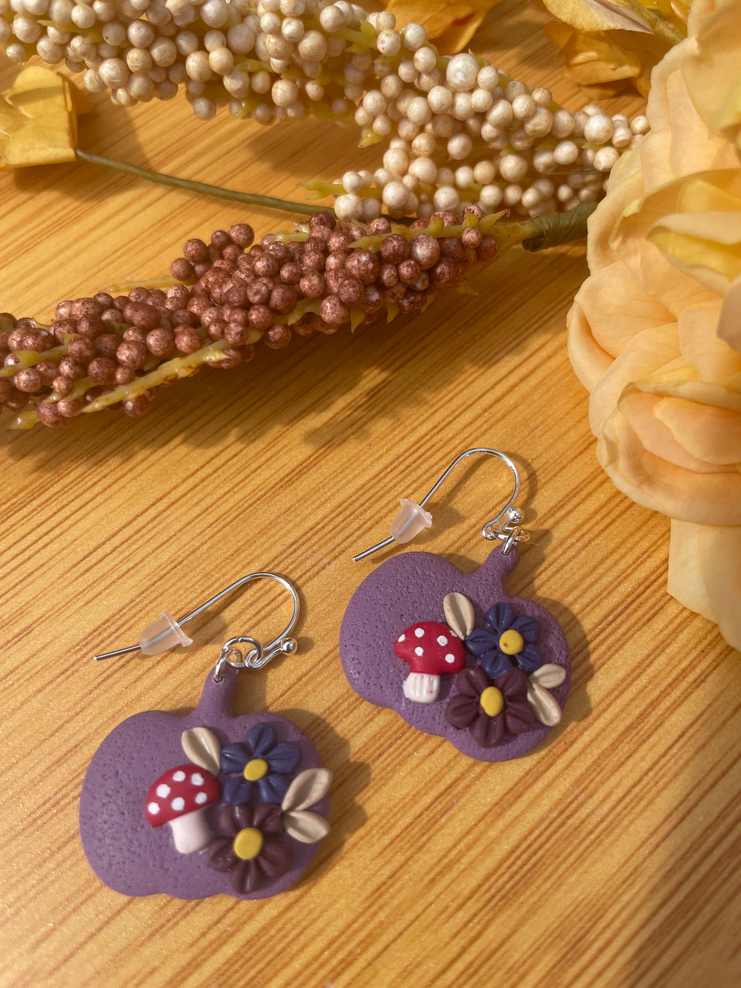 Purple floral pumpkin dangles