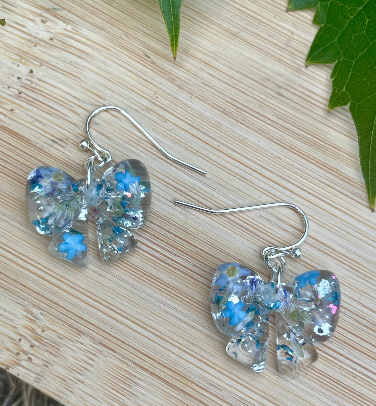 Blue burst bow earrings