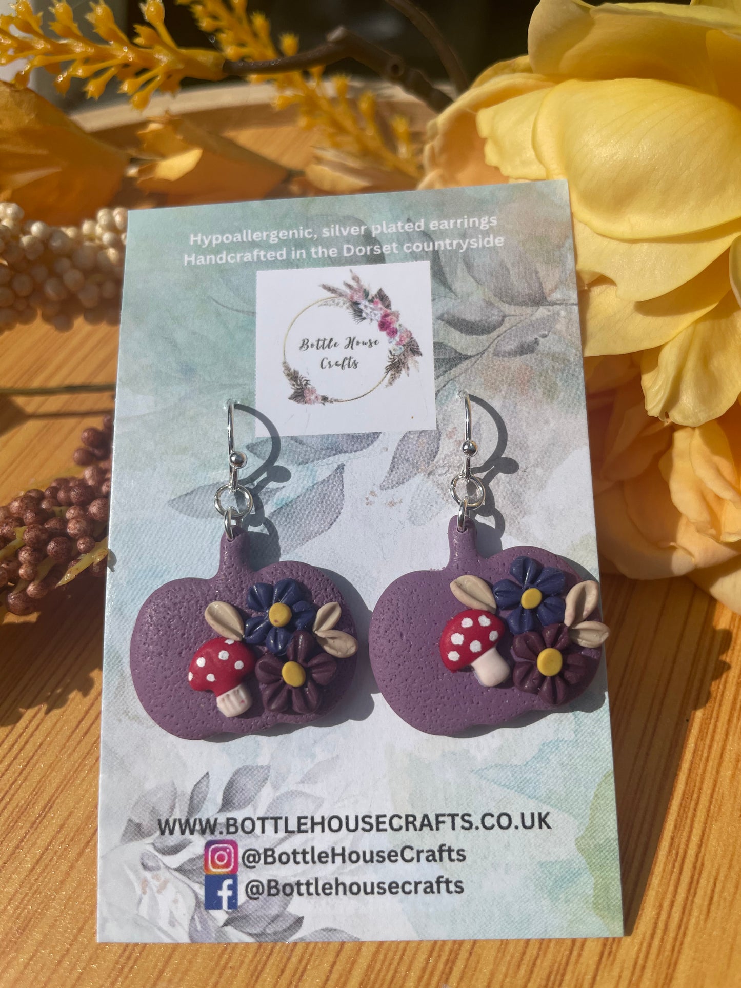 Purple floral pumpkin dangles