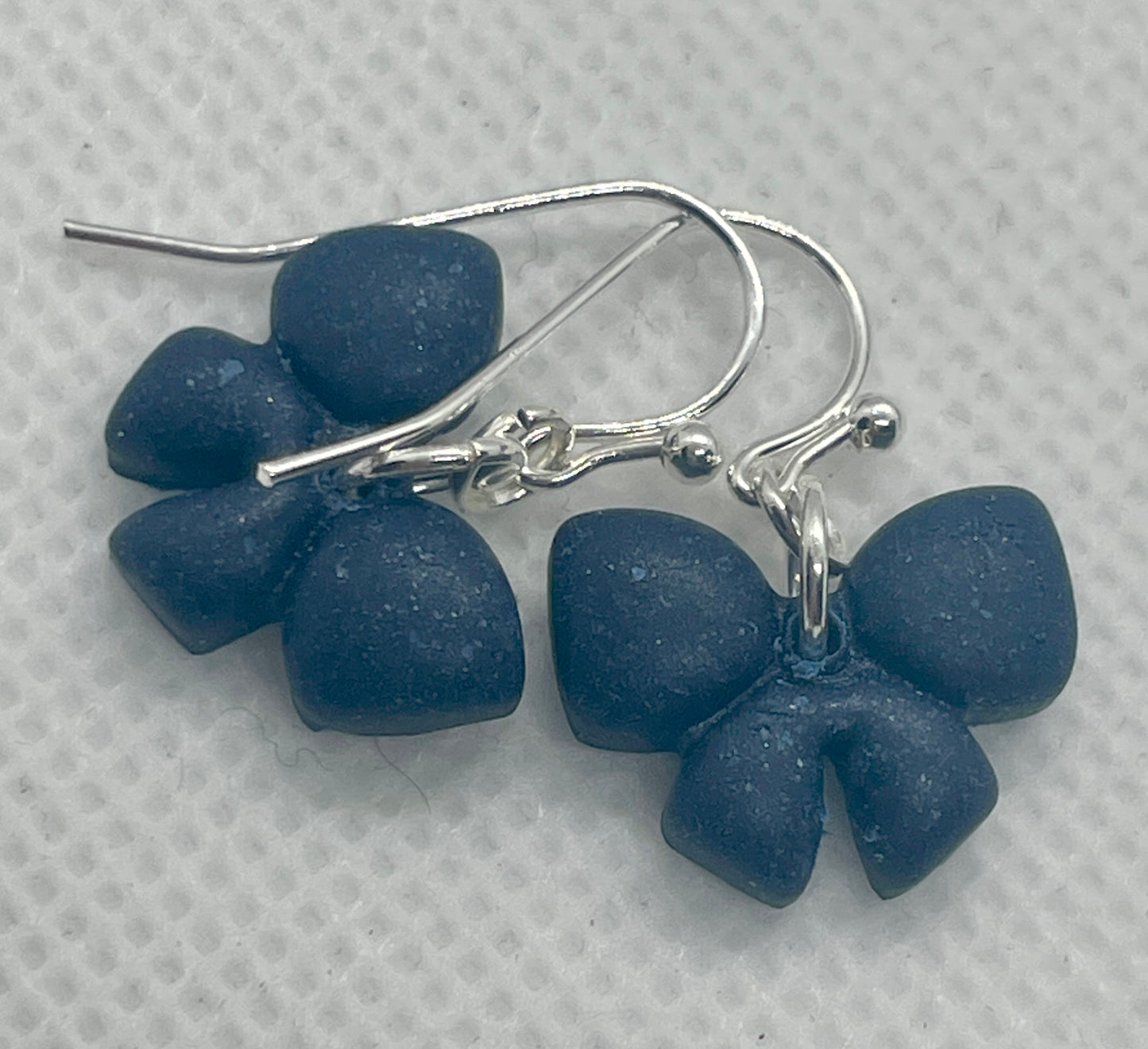 Small navy blue winter bow earrings