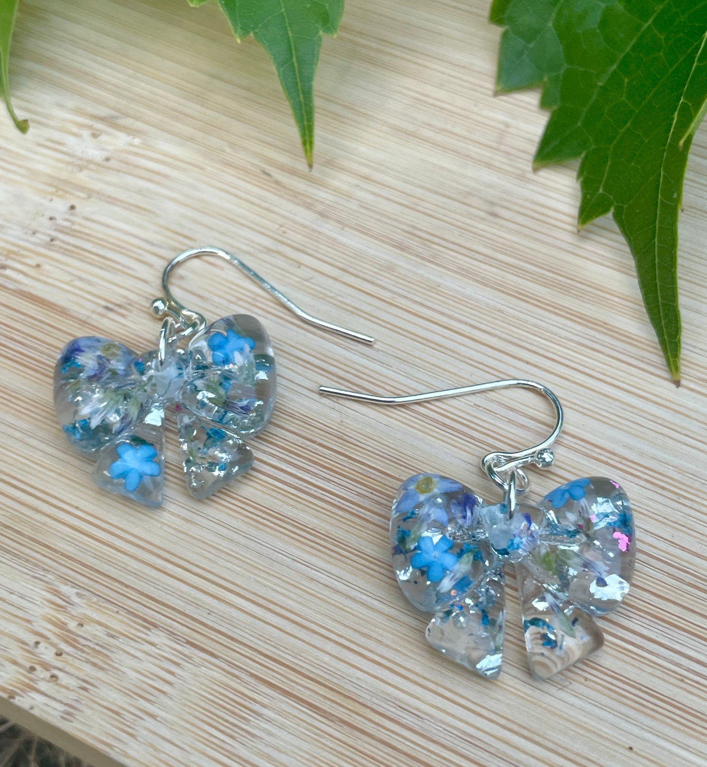 Blue burst bow earrings