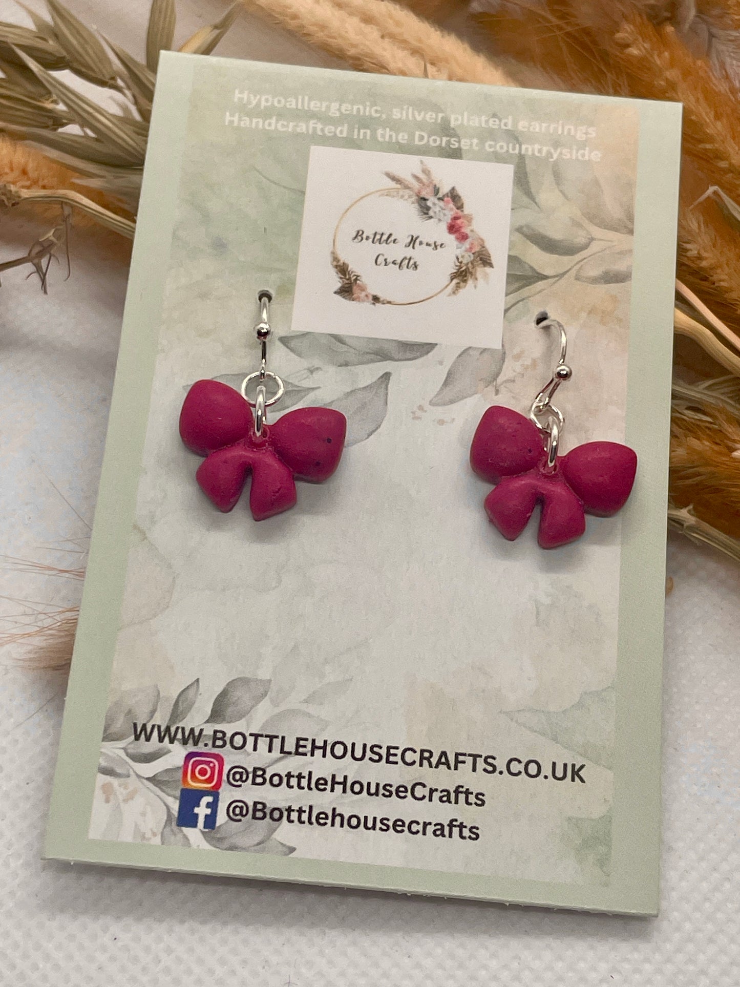 Mini deep pink winter bow earrings