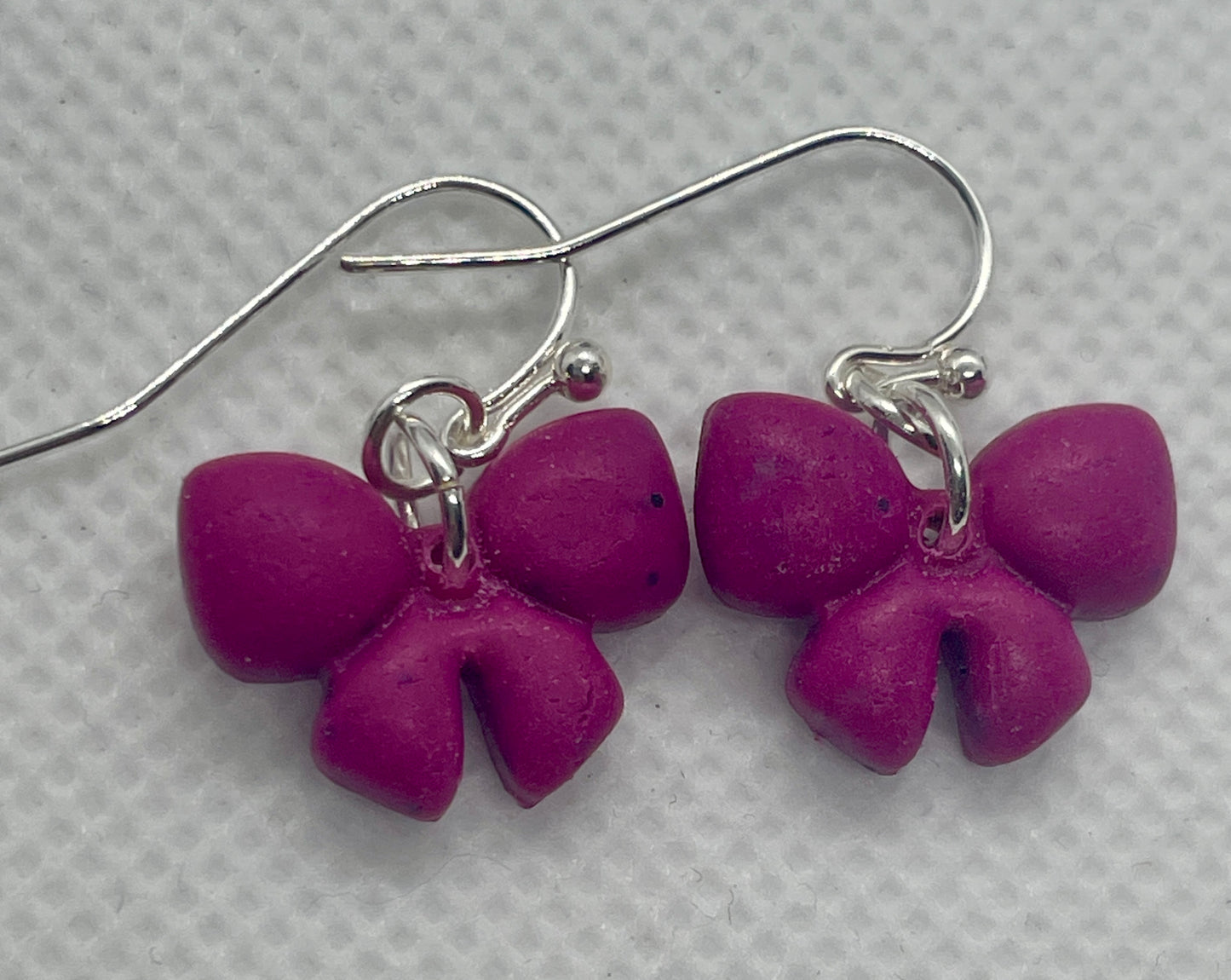 Deep pink small bow earrings