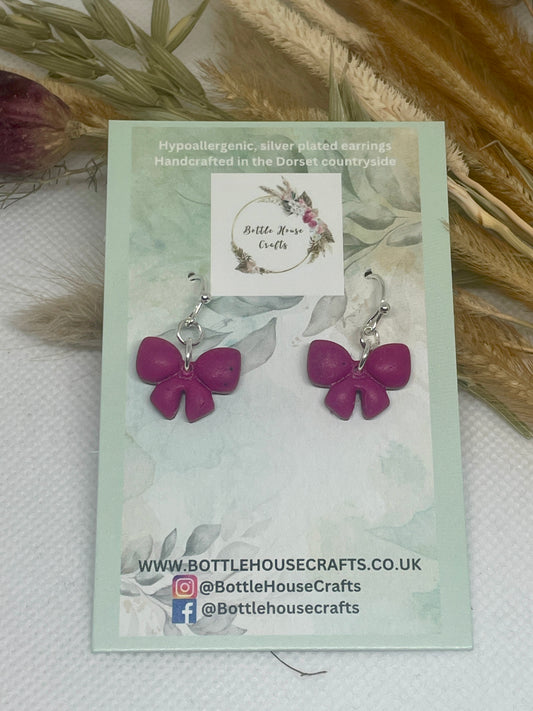 Deep pink small bow earrings