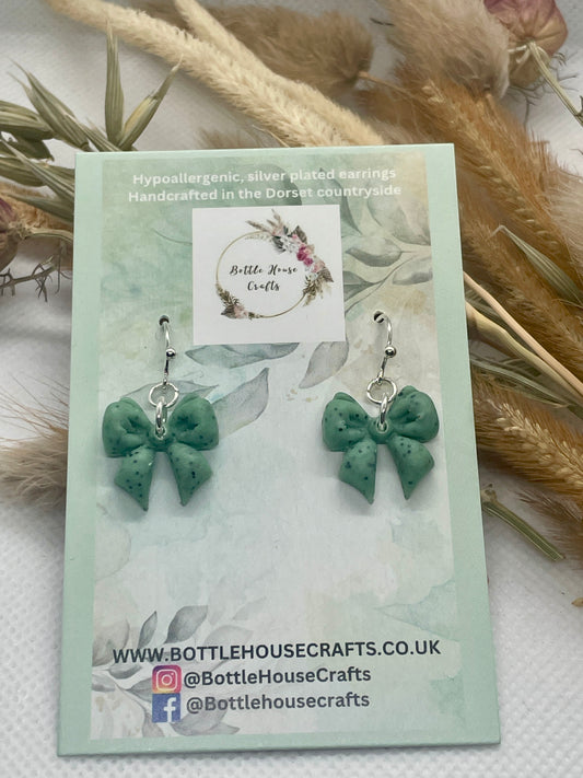 Sage green speckle midi winter bow earrings