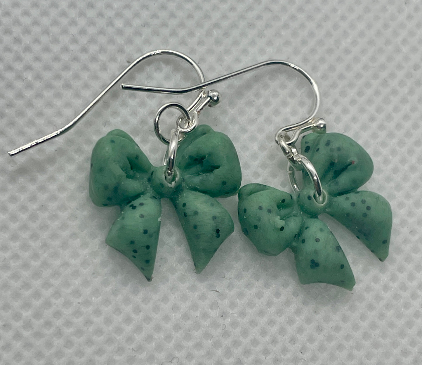 Sage green speckle midi winter bow earrings