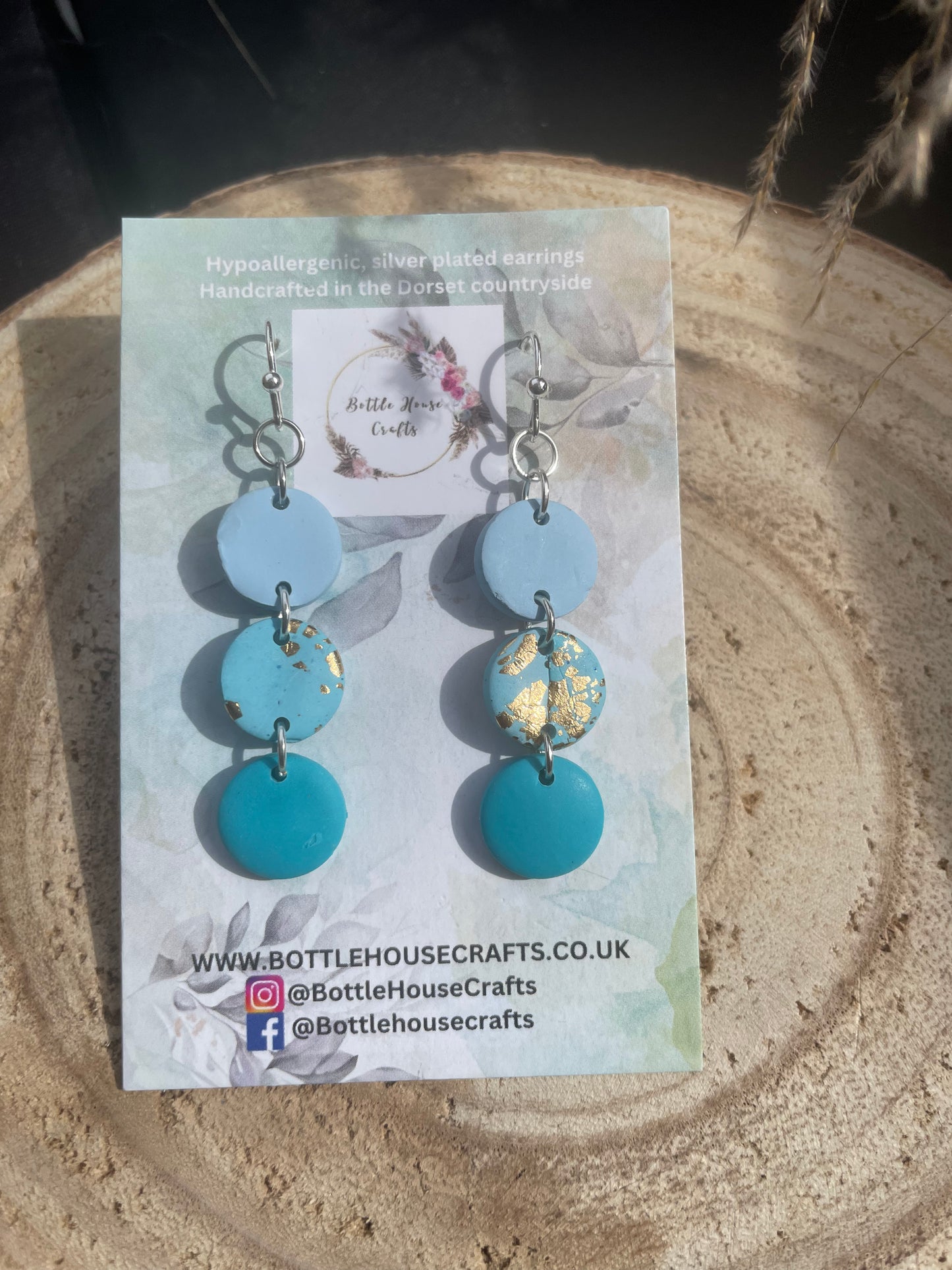 Triple drop blue button earrings