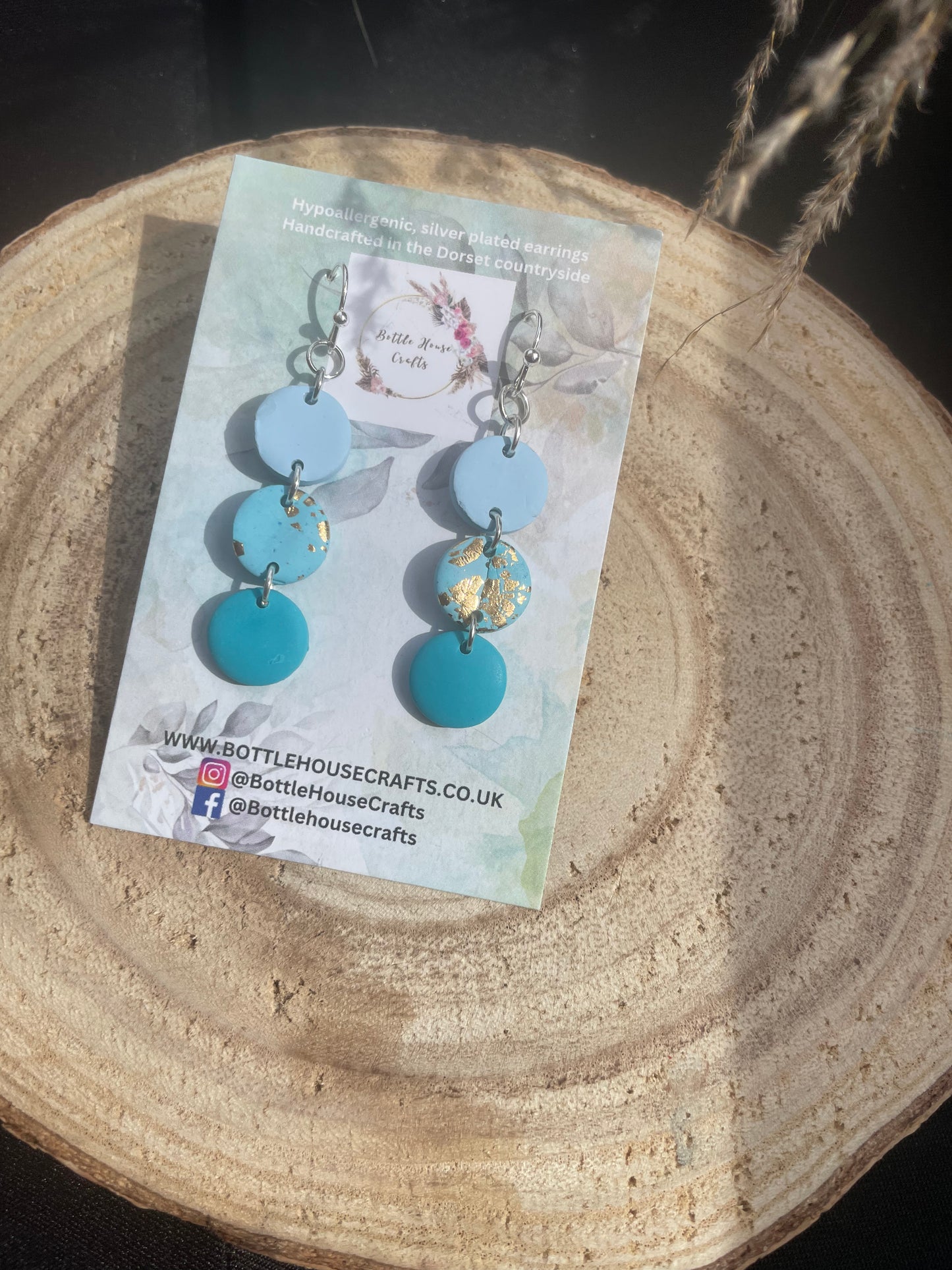 Triple drop blue button earrings